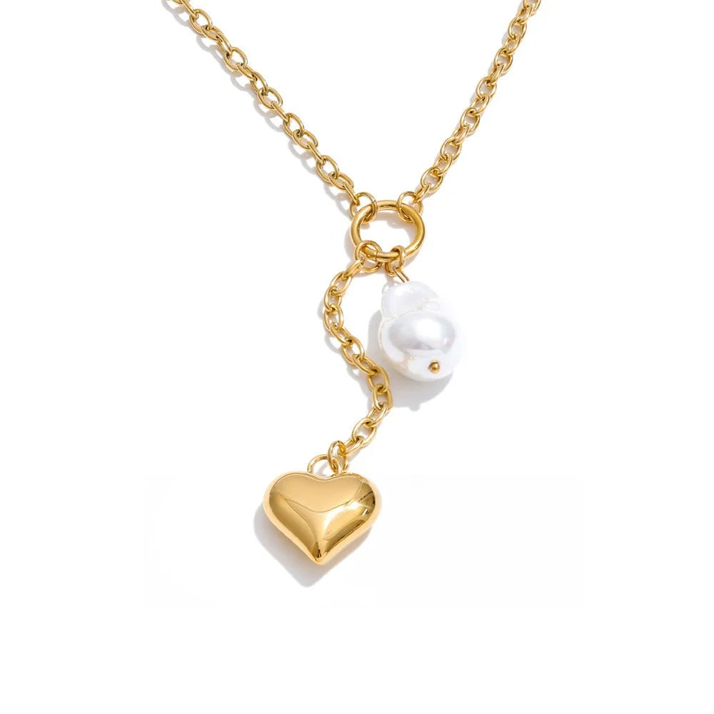 Gold-plated stainless steel necklace with pearl pendant featuring a heart charm and a small white bird charm.