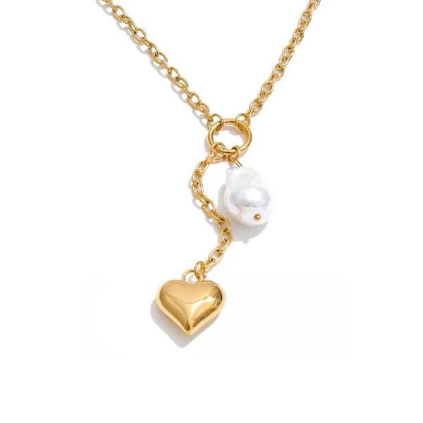 Gold-plated stainless steel necklace with pearl pendant featuring a heart charm and a small white bird charm.