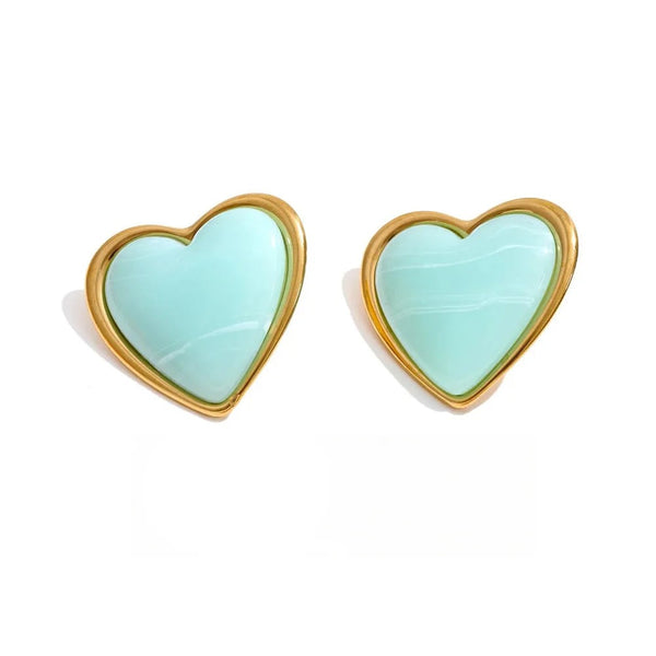 Gold-plated stainless steel earrings with resin and acrylic hearts in a light blue color.