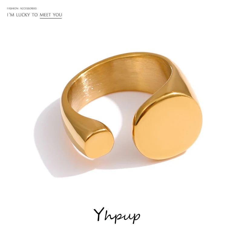 Gold-plated stainless steel ring with two large circular cutouts.