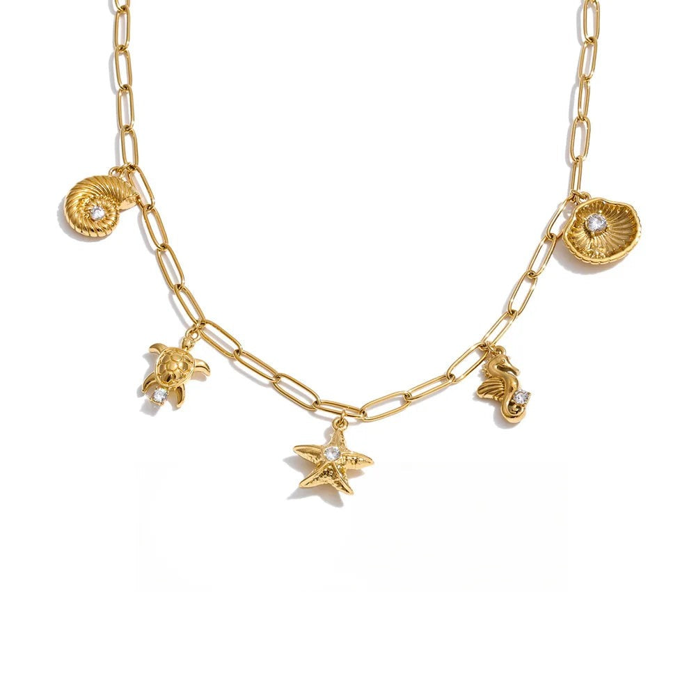 Gold-plated stainless steel necklace with cubic zirconia and shell charms.