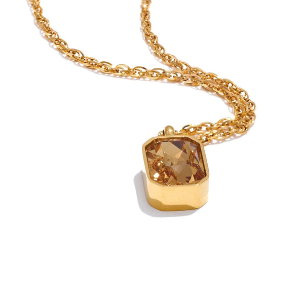 Gold-plated necklace with cubic zirconia stone.