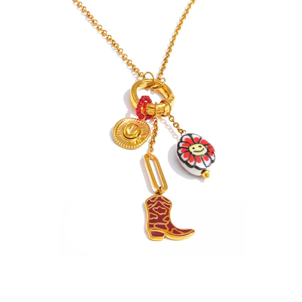 Gold-plated stainless steel necklace with a cowboy boot charm, featuring a red flower, a blue bird, and a yellow bell.