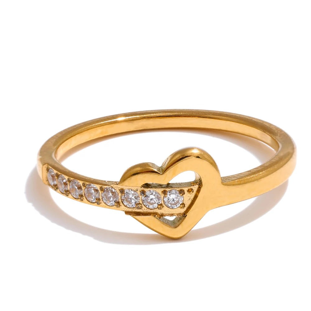 Gold-plated ring with cubic zirconia heart design.