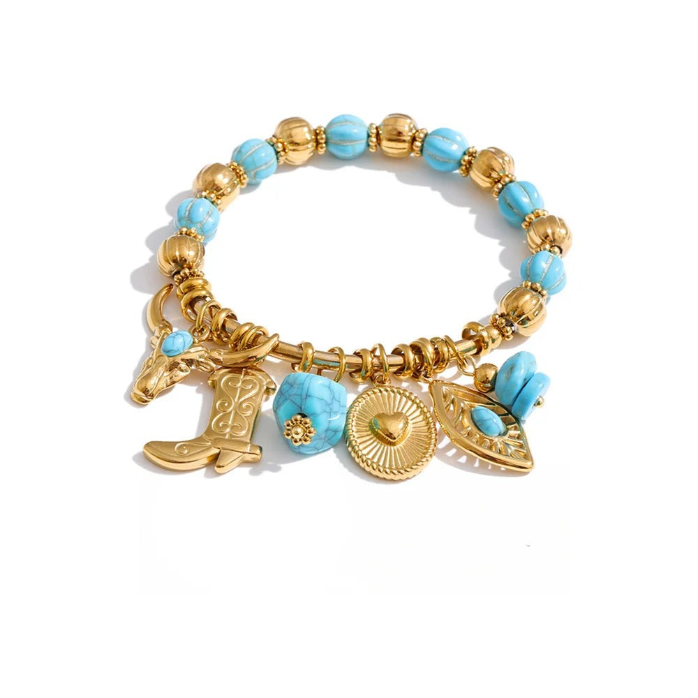 Gold-plated bracelet with blue stones and a cowboy charm.