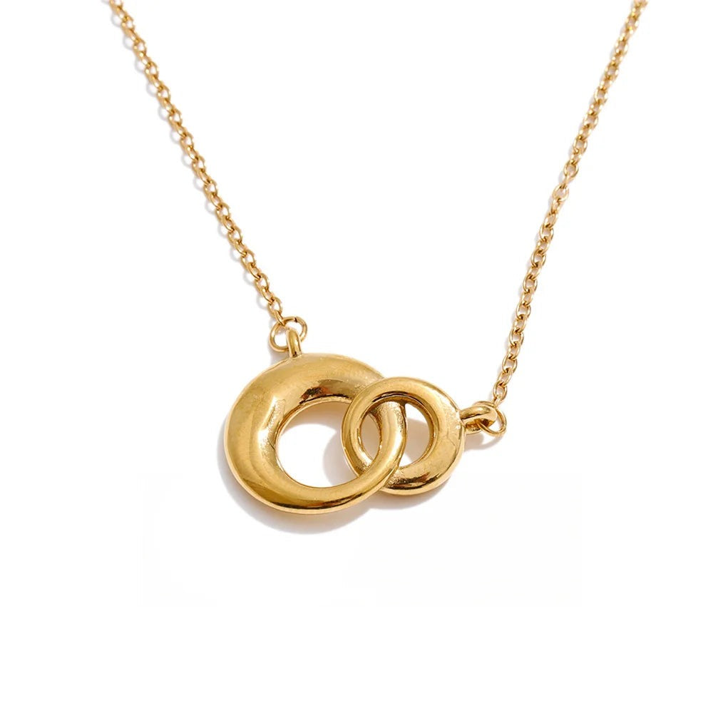 Gold-plated stainless steel necklace featuring a large ring pendant with two intertwined rings.