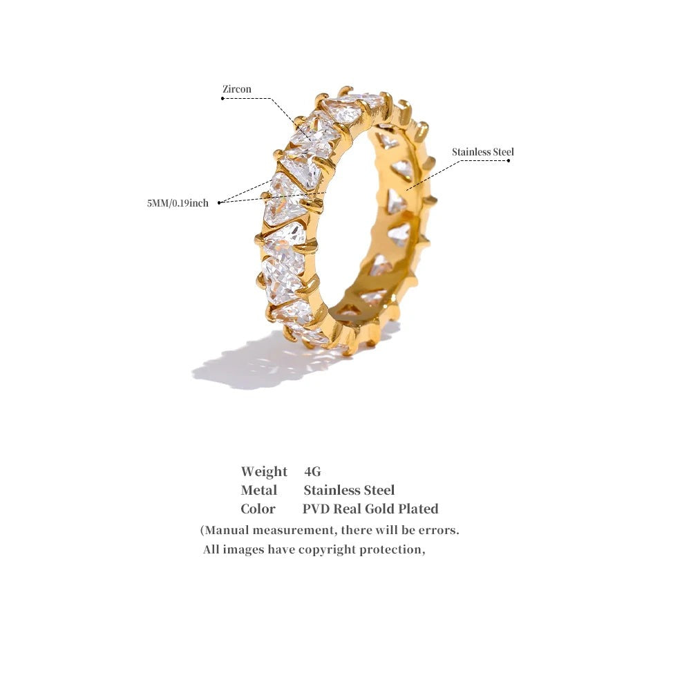Cubic zirconia heart geometric ring in gold-plated stainless steel with cubic zirconia.