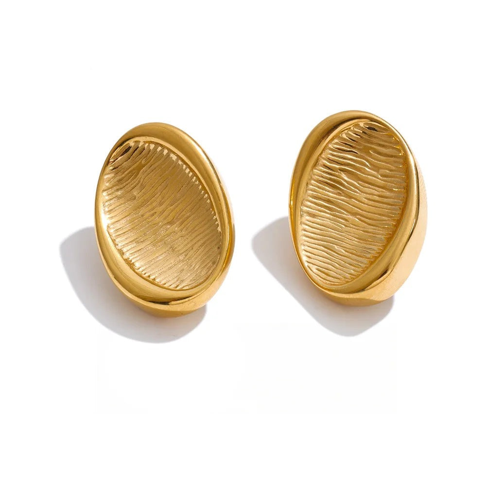 Gold-plated stainless steel earrings with a unique leaf design.