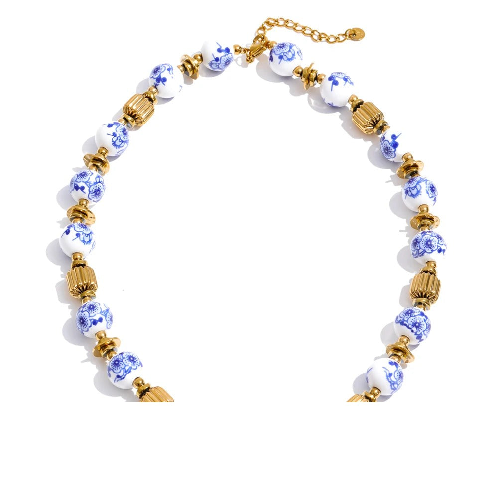 Blue flower beaded necklace in gold-plated stainless steel.