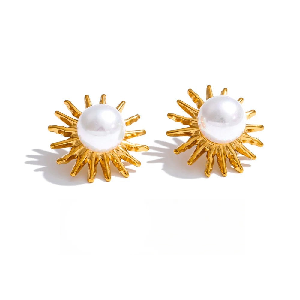 Gold-plated earrings with pearls, featuring sunburst design.