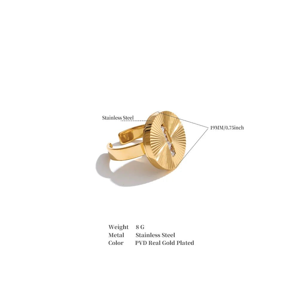 Cubic zirconia geometric ring in 18K gold-plated stainless steel with cubic zirconia.