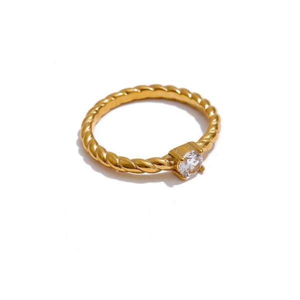 Gold-plated stainless steel ring with cubic zirconia.