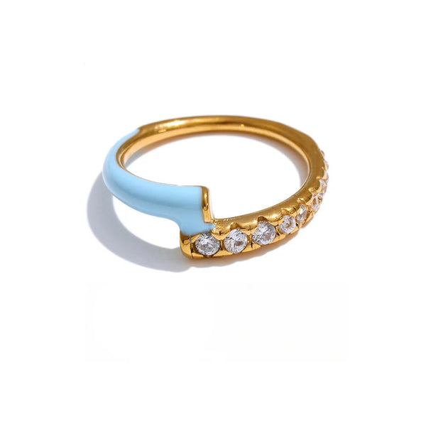 Gold-plated stainless steel ring with cubic zirconia and enamel detailing a blue toothbrush shape.