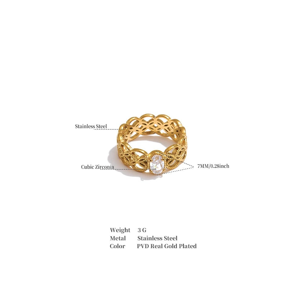 Cubic zirconia geometric ring in 18K gold-plated stainless steel with cubic zirconia.