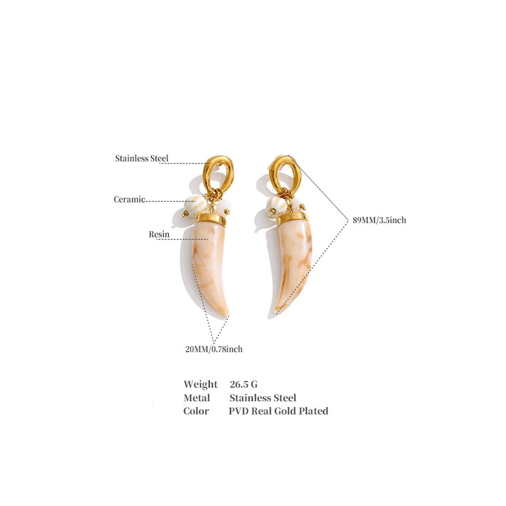 Resin acrylic geometric earrings in gold-plated stainless steel with resin and acrylic.