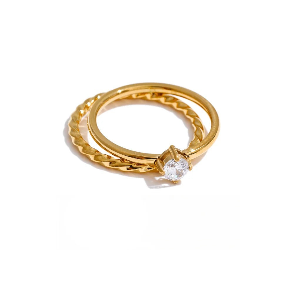 Gold-plated stainless steel ring with cubic zirconia.