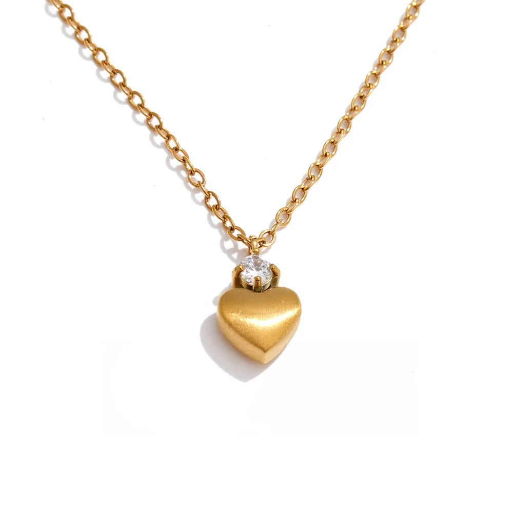 Gold-plated stainless steel necklace with cubic zirconia heart pendant.