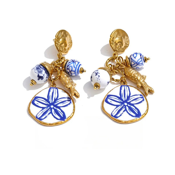 Gold-plated stainless steel earrings with blue and white floral design.