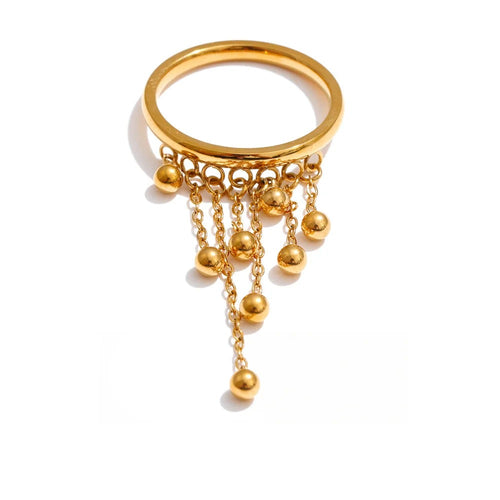 Gold-plated stainless steel ring with multiple spherical beads hanging from it.