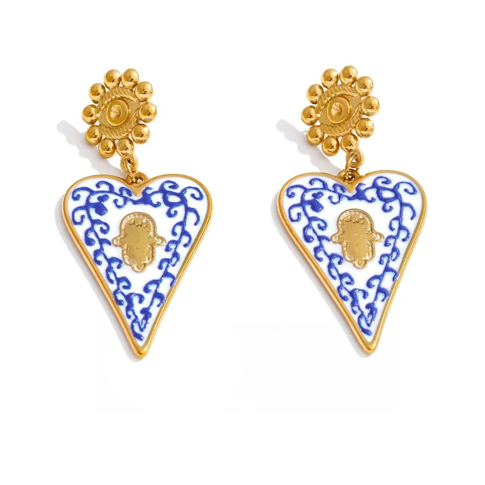 Gold-plated stainless steel earrings with blue enamel heart pendant.