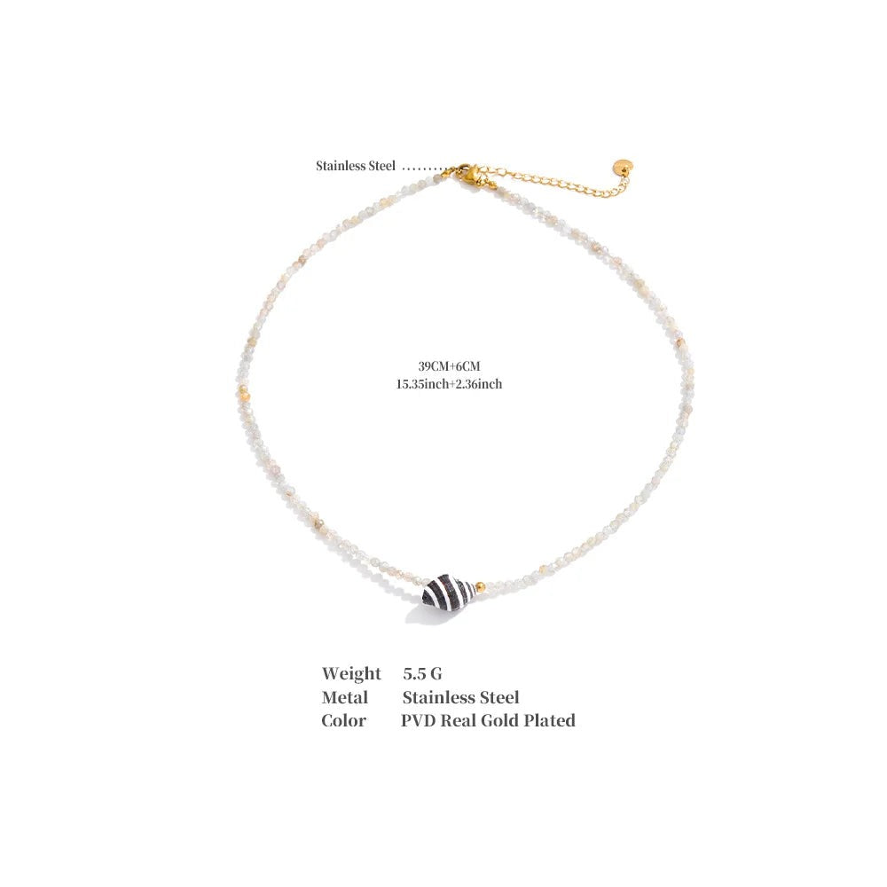 Crystal geometric necklace in gold-plated stainless steel with crystal.