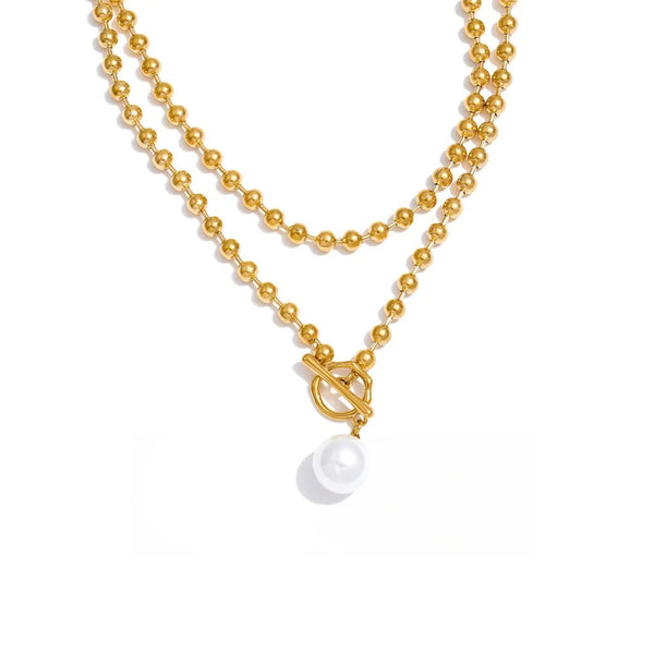 Gold-plated stainless steel necklace with pearl pendant.