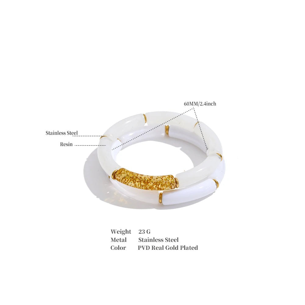 Resin acrylic geometric bracelet in gold-plated stainless steel with resin and acrylic.
