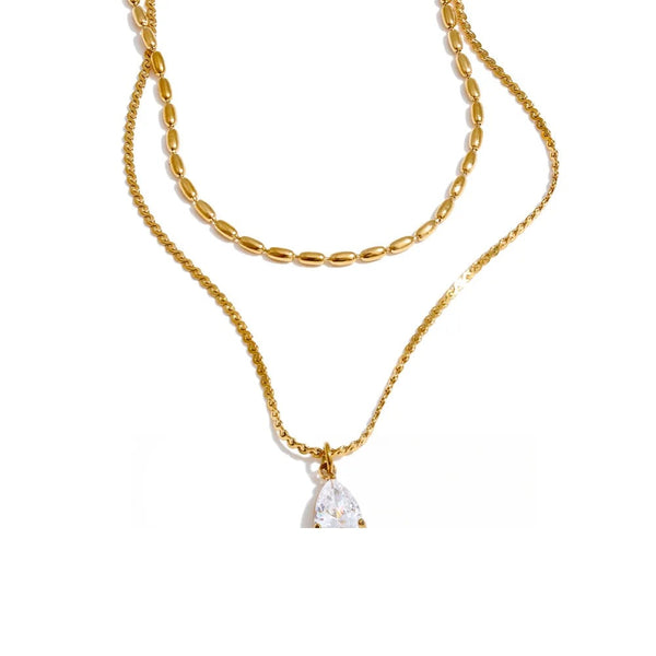 Gold-plated stainless steel necklace with cubic zirconia pendant.
