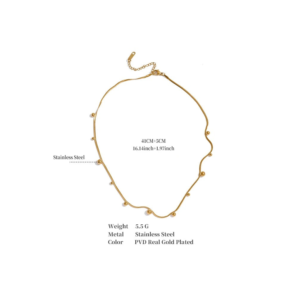 Beaded geometric chain necklace in gold-plated stainless steel.
