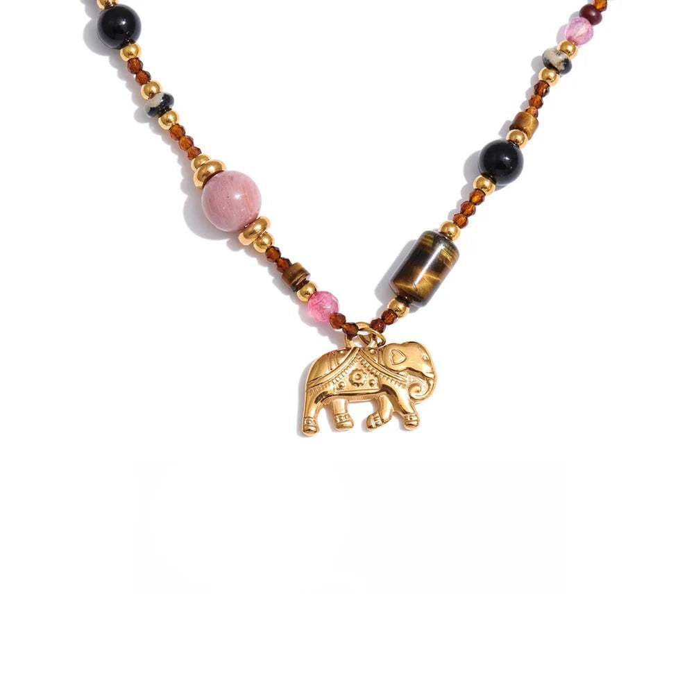 Gold-plated stainless steel necklace with pink stone and an elephant charm.