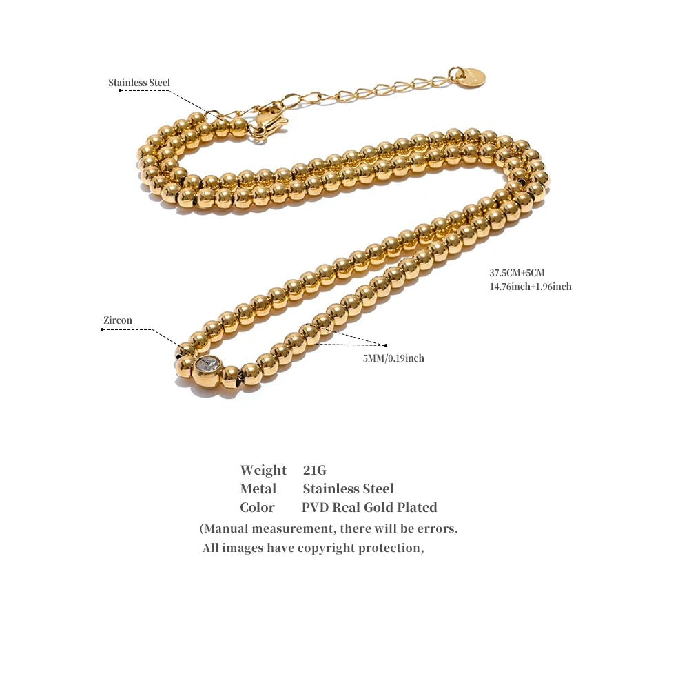 Cubic zirconia beaded geometric necklace in 18K gold-plated stainless steel with cubic zirconia.