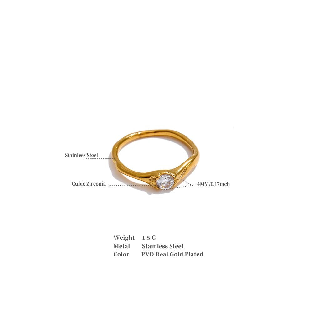 Cubic zirconia geometric ring in 18K gold-plated stainless steel with cubic zirconia.