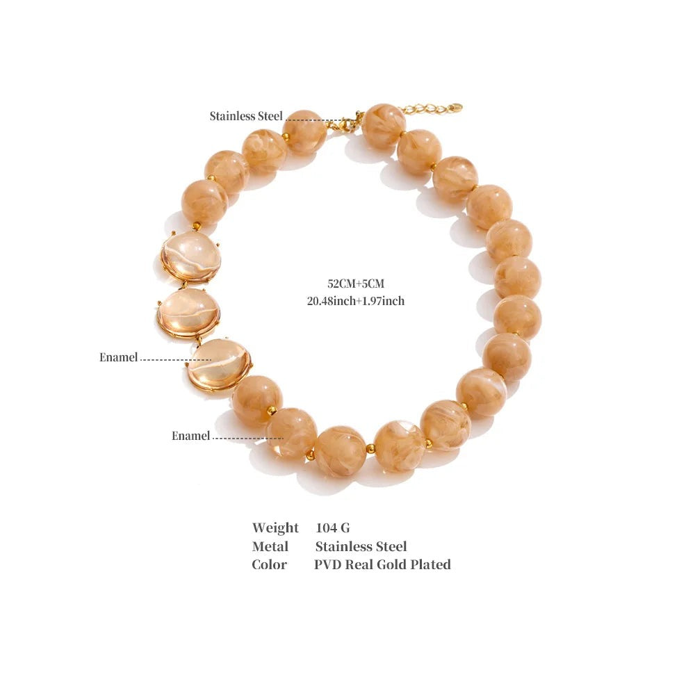 Resin acrylic beaded necklace in gold-plated stainless steel with resin and acrylic.