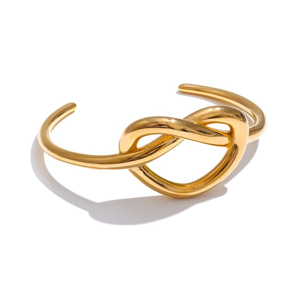 Gold-plated stainless steel bracelet featuring a twisted design.