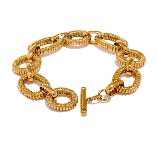 Gold-plated stainless steel bracelet with a chain link design.