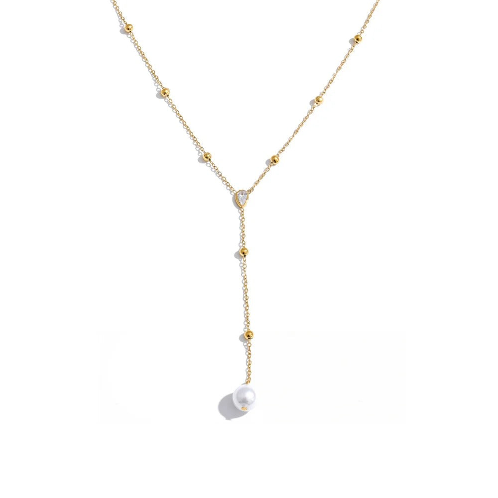 Gold-plated stainless steel necklace with pearl and cubic zirconia.
