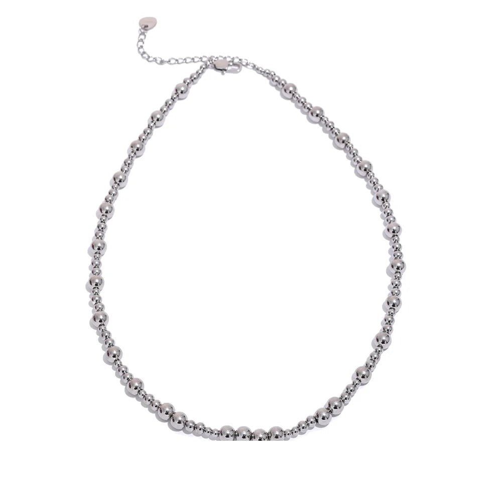 Beaded geometric chain necklace in gold-plated stainless steel.