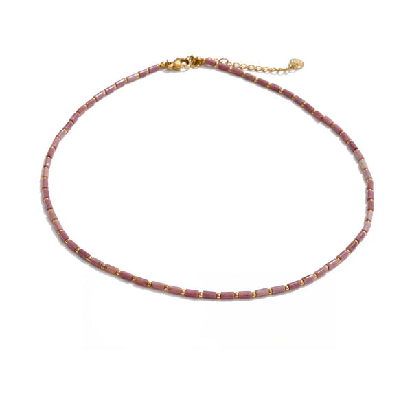 Gold-plated stainless steel necklace with red gemstones.