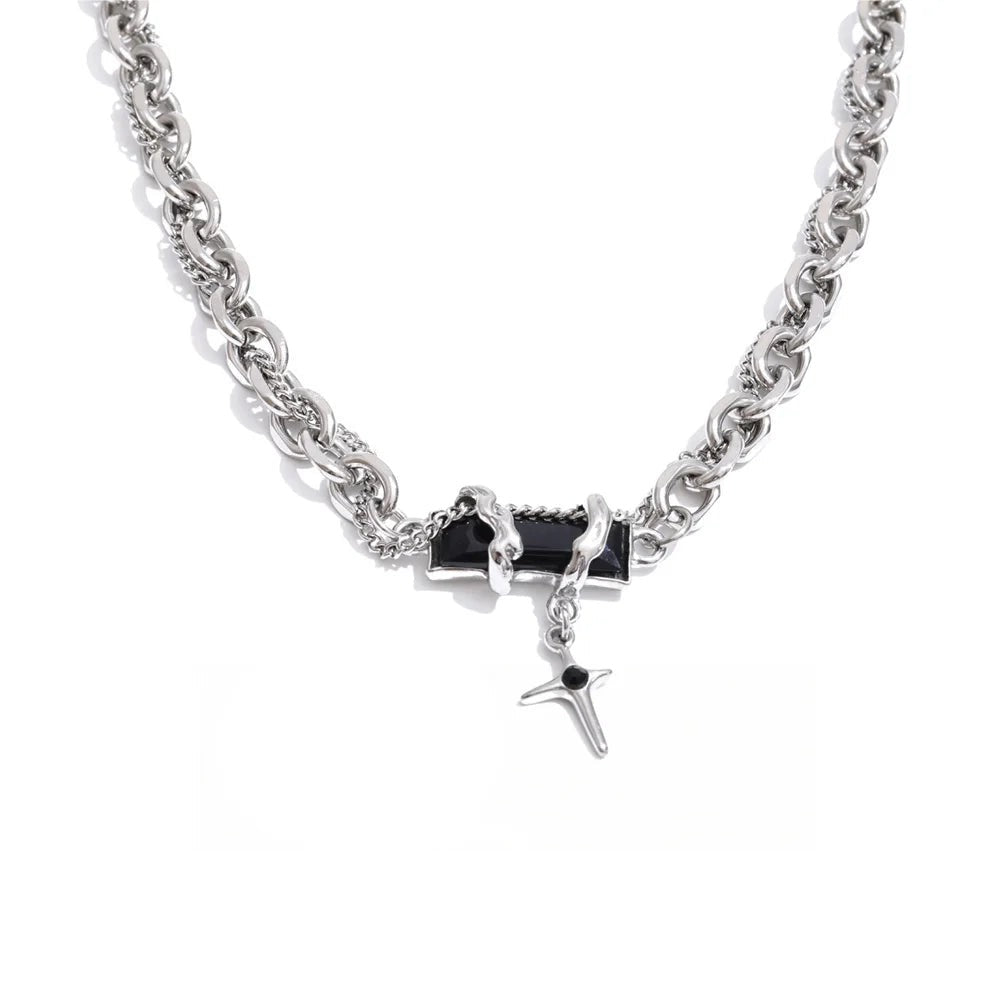 Gold-plated stainless steel necklace with black stone pendant featuring a chain link design.