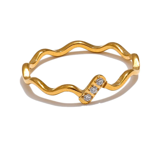 Ring made of gold-plated stainless steel with cubic zirconia.