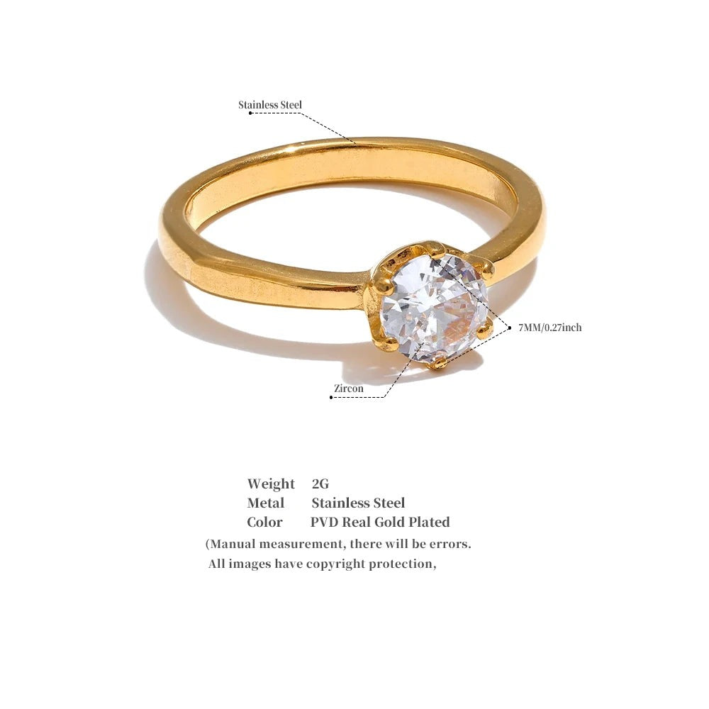 Cubic zirconia geometric ring in 18K gold-plated stainless steel with cubic zirconia.