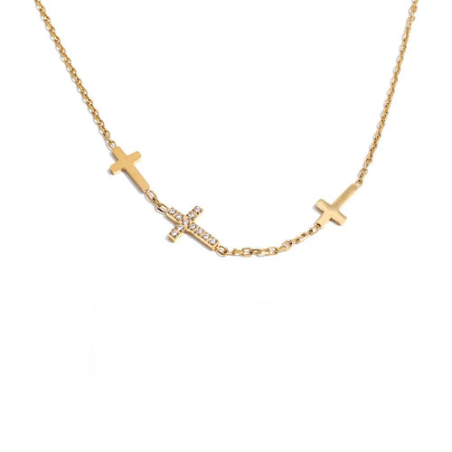 Gold-plated stainless steel necklace with cross pendant and cubic zirconia stones.