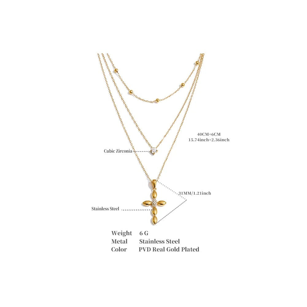 Cubic zirconia cross chain necklace in gold-plated stainless steel with cubic zirconia.