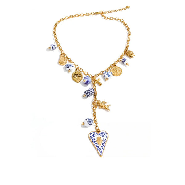 Gold-plated stainless steel necklace with blue and white beads and a heart pendant.