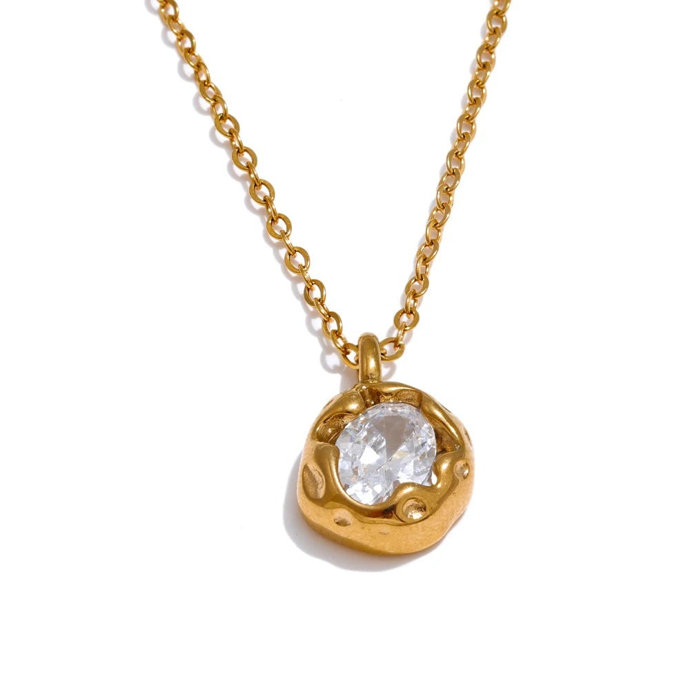 Gold-plated stainless steel necklace with cubic zirconia pendant.