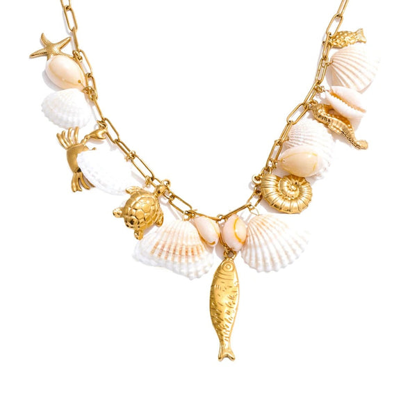 Gold-plated necklace with seashells and a fish charm.