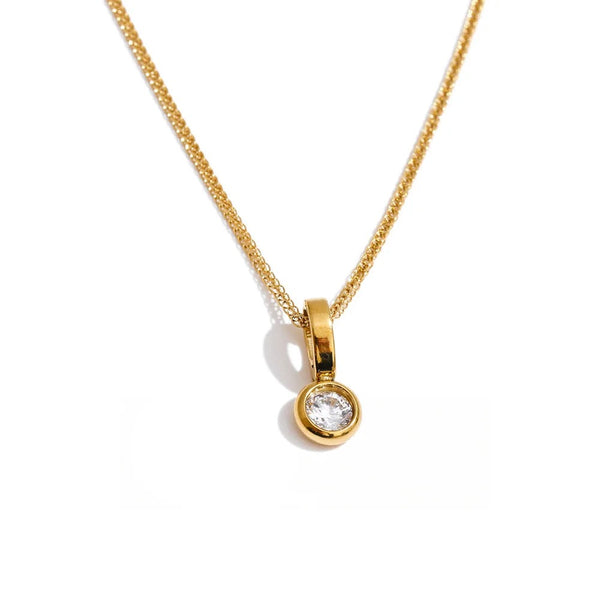 Gold-plated stainless steel necklace with cubic zirconia pendant.