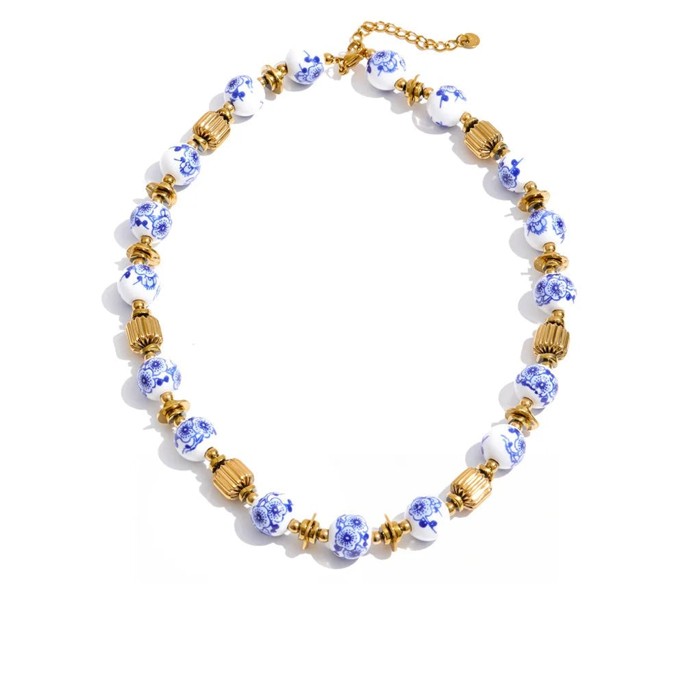 Gold-plated stainless steel necklace with blue beads.