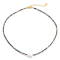 Crystal geometric necklace in gold-plated stainless steel with crystal.